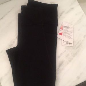 Athleta Meshblock stash pocket salutation tight